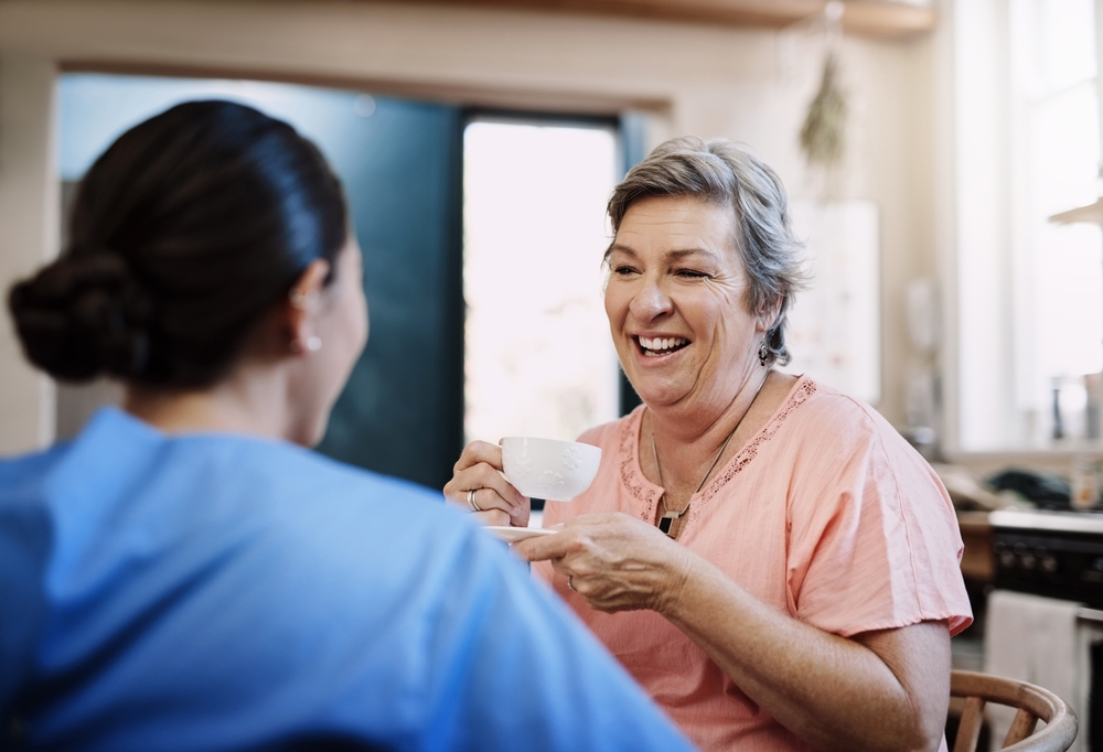 Retirement,,Caregiver,And,Happy,Woman,In,Kitchen,For,Support,,Kindness